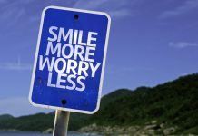 Smile More Worry Less sign scaled