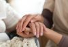 bigstock Caregiver Holding Senior Woman 203066512 scaled