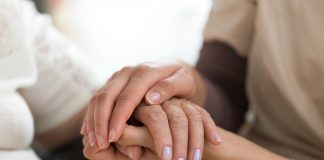 bigstock Caregiver Holding Senior Woman 203066512 scaled