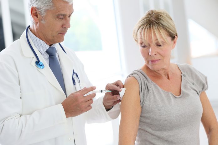 bigstock Doctor injecting flu vaccine t 102391031 scaled