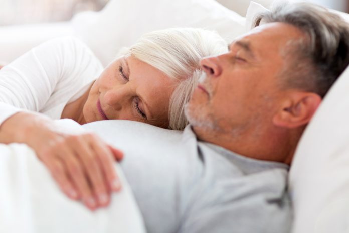 bigstock Senior couple sleeping in bed 150187760 scaled