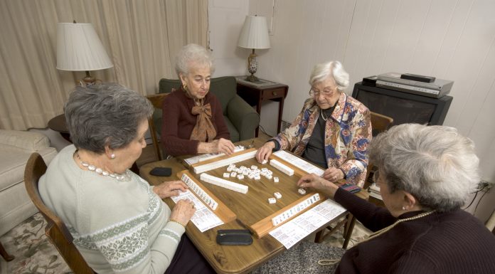 bigstock Senior Woman At The Game Table 1143562 scaled