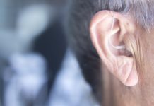 bigstock Hearing Aid In Ear 212550868 scaled