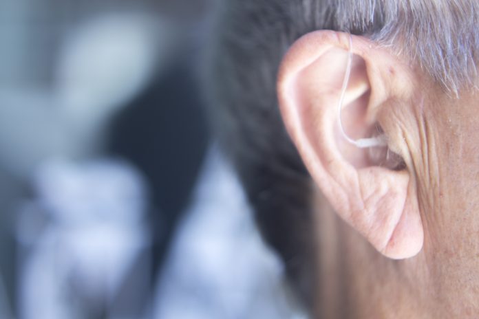 bigstock Hearing Aid In Ear 212550868 scaled