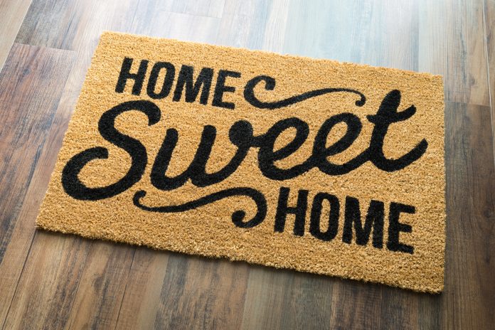 bigstock Home Sweet Home Welcome Mat On 154129802 scaled