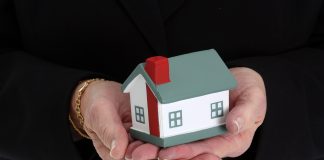 bigstock Woman Holding House 5170281 scaled