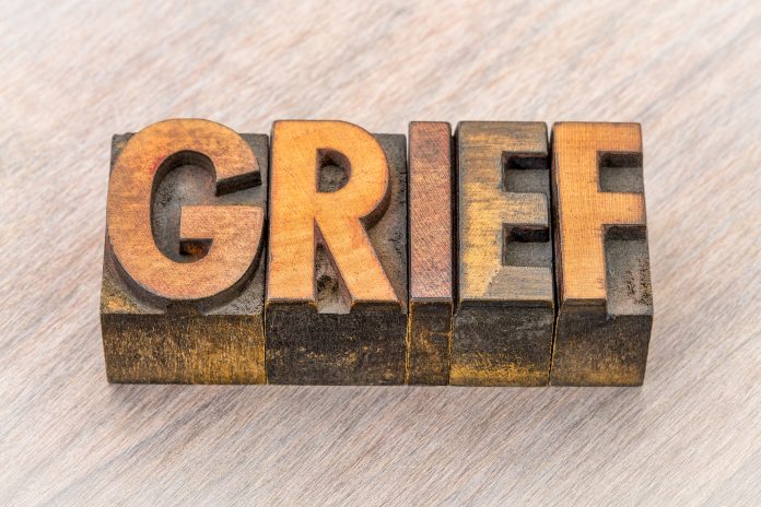 bigstock grief word abstract in vintage 215100097 scaled