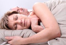 bigstock Senior couple laid in a bed 12593837 scaled