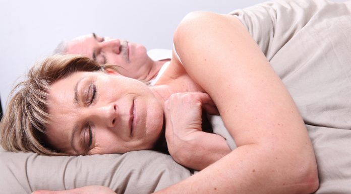 bigstock Senior couple laid in a bed 12593837 scaled