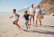 bigstock Grandparents Running Along Bea 233393224 scaled