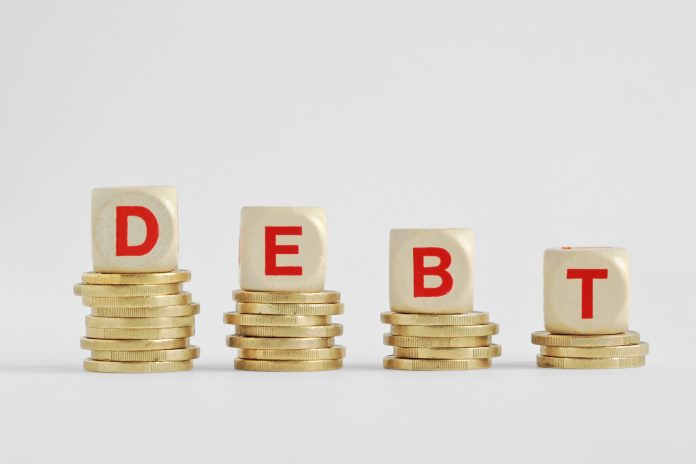 bigstock The Word Debt Written With Woo 242109769 scaled