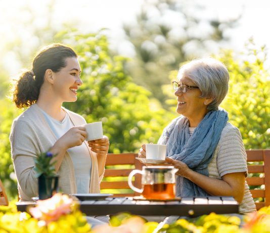 women drinking tea in the garden