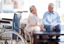 Lovely retired couple talking on the sofa