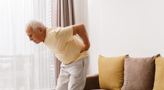 Senior man is suffering from pain in lower back