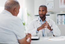 Doctor, patient and consultation with conversation for healthcare, people in office with advice or instructions for medication. Treatment, medical info and elderly care with communication at clinic